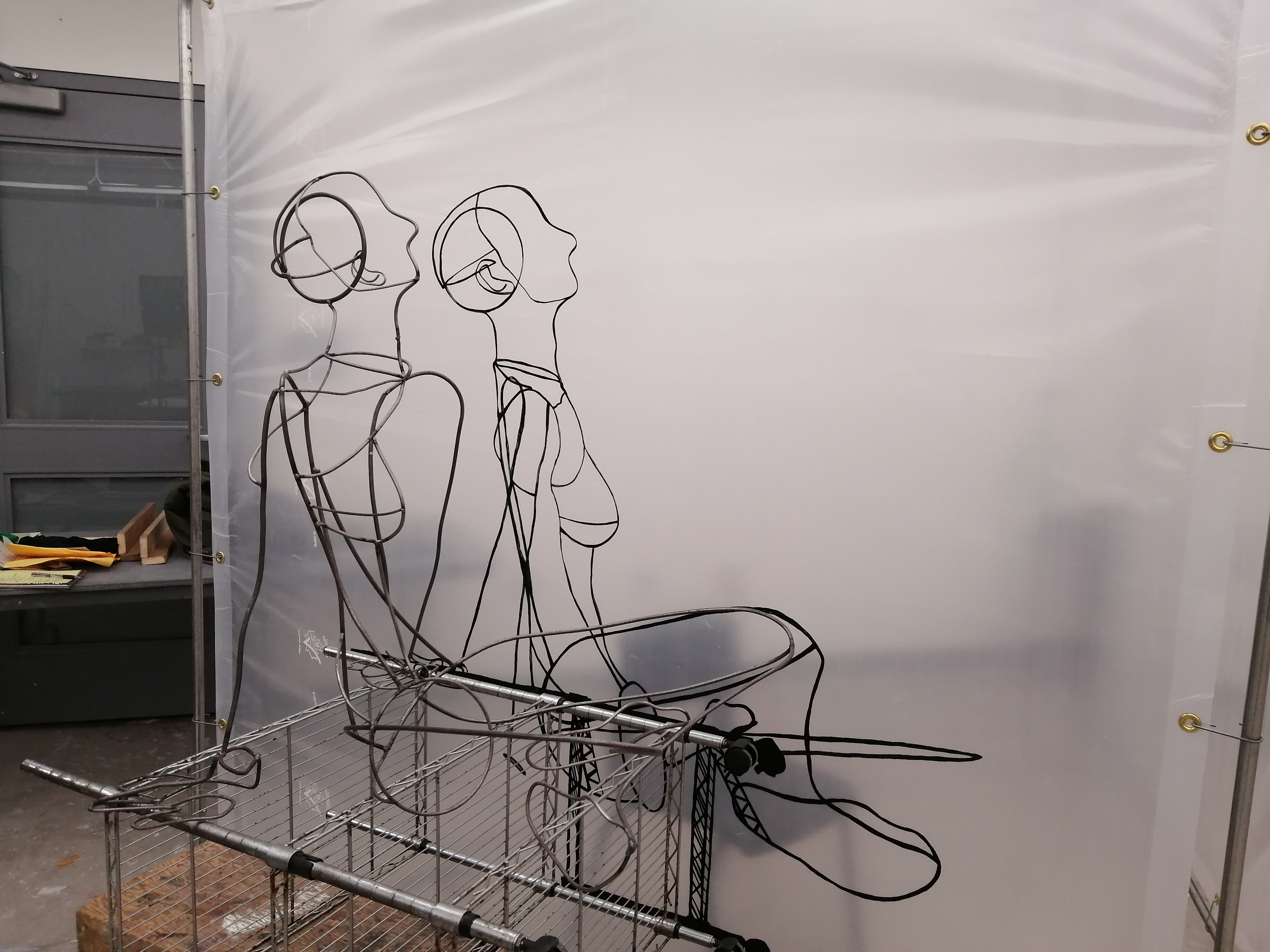 an artwork by Ada Denil consisting of translucent welding screens with line drawings